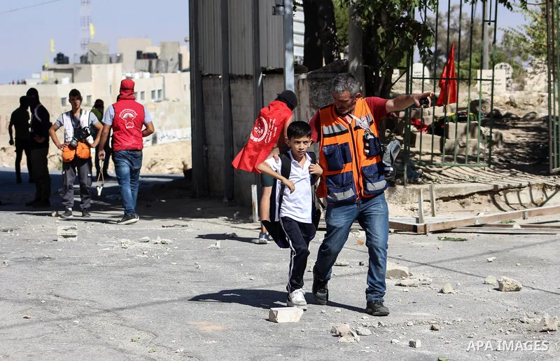 Palestinian protesters throw stones towards Israeli security forces during clashes following the funeral of 14-year-old Naseem Abu Roumi in the occupied West Bank village of al-Eizariya on September 21, 2019. Al-Roumi ki...