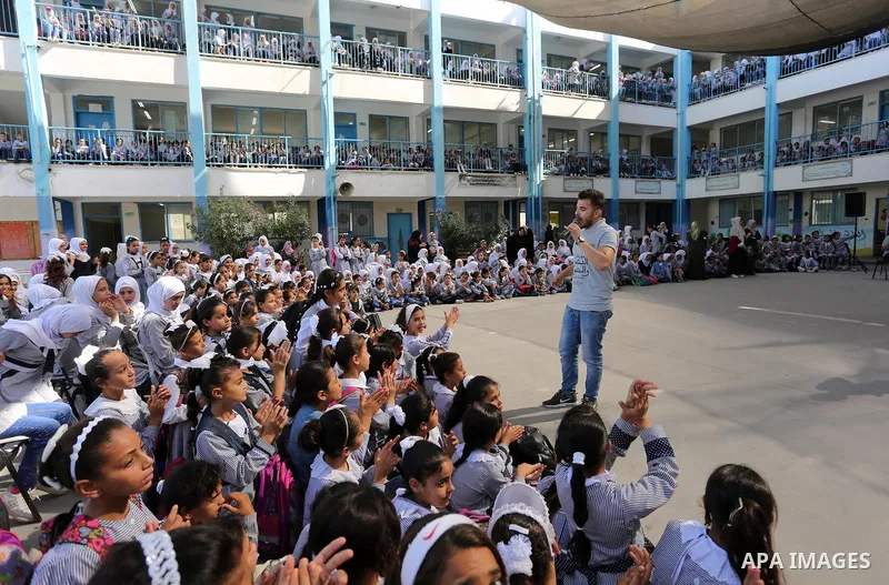 Palestinian students attend the Sea and Freedom Festival, at their school run by the United Nations Relief and Works Agency (UNRWA), in Beit Hanoun in the northern Gaza Strip, on September 26, 2019. Photo by Ashraf Amra