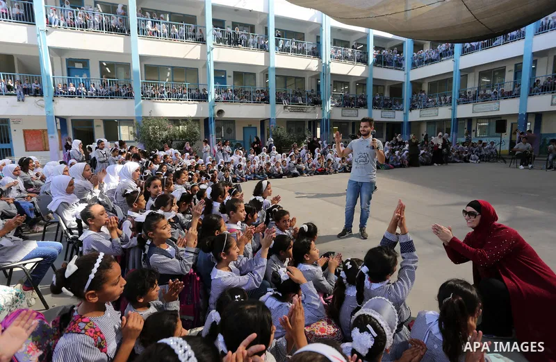 Palestinian students attend the Sea and Freedom Festival, at their school run by the United Nations Relief and Works Agency (UNRWA), in Beit Hanoun in the northern Gaza Strip, on September 26, 2019. Photo by Ashraf Amra