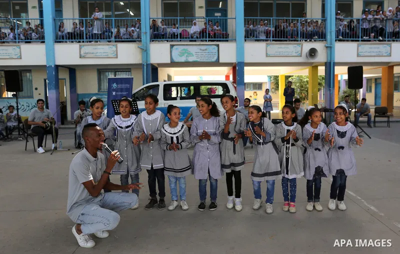 Palestinian students attend the Sea and Freedom Festival, at their school run by the United Nations Relief and Works Agency (UNRWA), in Beit Hanoun in the northern Gaza Strip, on September 26, 2019. Photo by Ashraf Amra