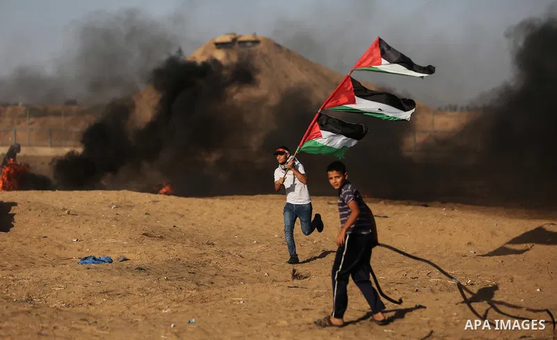 Palestinian protesters clash with Israeli troops following the tents protest where Palestinians demand the right to return to their homeland at the Israel-Gaza border, in Khan Younis in the southern Gaza Strip, Spetember...