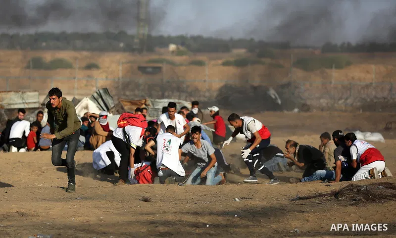 A wounded Palestinian protester is evacuated during clashes with Israeli troops following the tents protest where Palestinians demand the right to return to their homeland at the Israel-Gaza border, in Khan Younis in the...