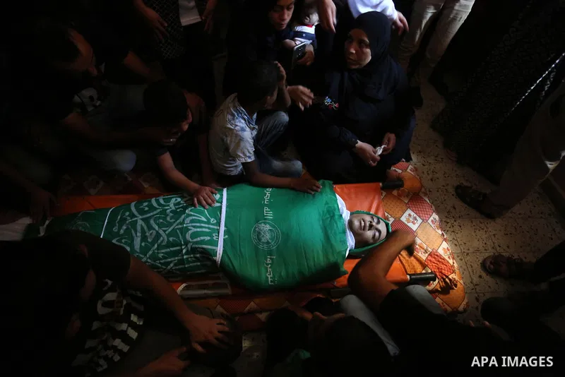 Mourners carry the body of Palestinian Saher Othman, 20, who was died of his wounds which he sustained by Israeli forces during clashes in tents protest where Palestinians demand the right to return to their homeland at...