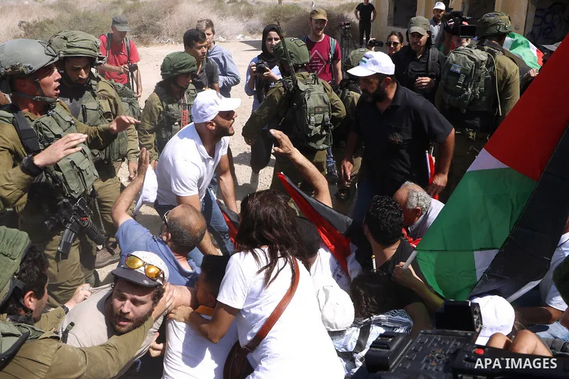 Palestinian demonstrators take part in a protest against Israeli Prime Minister Benjamin Netanyahu, near the Dead Sea in the Israeli-occupied West Bank September 28, 2019. Photo by Sleman abo srour\WAFA