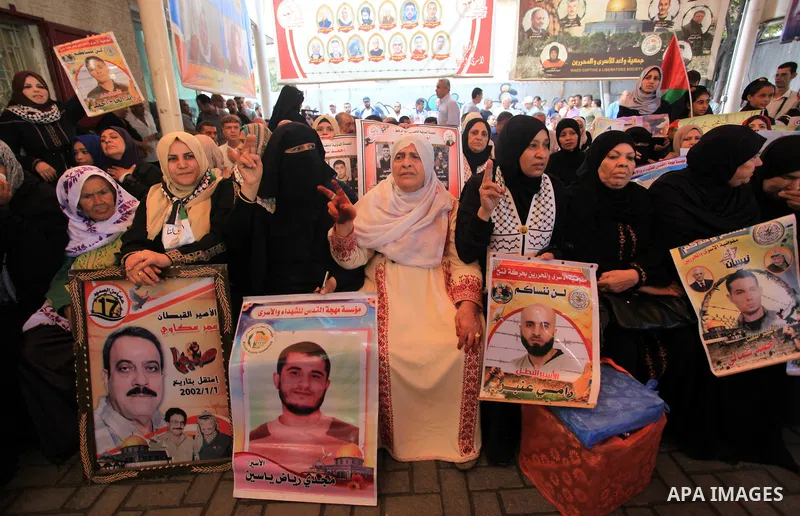 Palestinians take part in a protest in solidarity with prisoners in Israeli jails, in front of the Red cross office, in Gaza city on on September 30, 2019. Photo by Mahmoud Ajjour