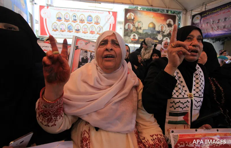 Palestinians take part in a protest in solidarity with prisoners in Israeli jails, in front of the Red cross office, in Gaza city on on September 30, 2019. Photo by Mahmoud Ajjour