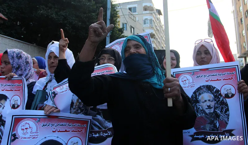 Palestinians take part in a protest in solidarity with prisoners in Israeli jails, in front of the Red cross office, in Gaza city on on September 30, 2019. Photo by Mahmoud Ajjour