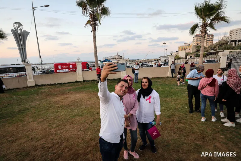 Palstininans take part in a rally during the Breast Cancer Awareness campaign at Gaza port in Gaza City, on October 1, 2019. Photo by Mahmoud Abu Hasira