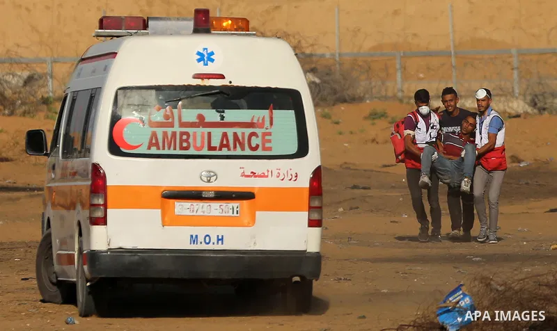 A wounded Palestinian protester is evacuated during clashes with Israeli troops following the tents protest where Palestinians demand the right to return to their homeland at the Israel-Gaza border, in Khan Younis in the...