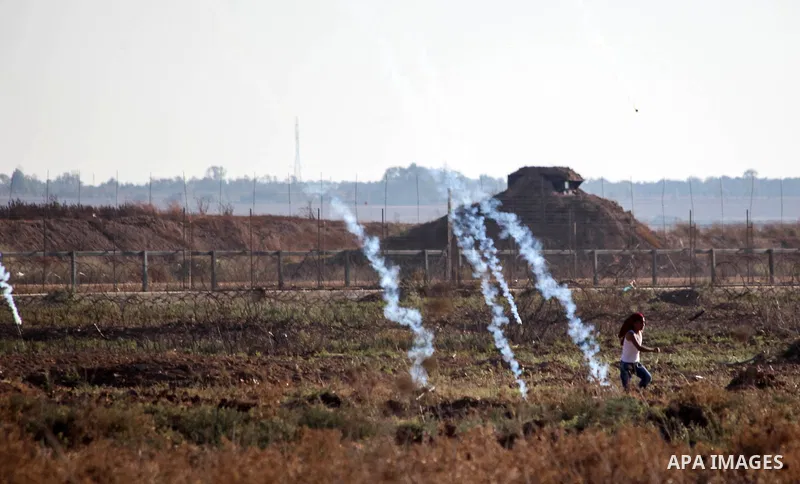 Palestinian protesters clash with Israeli troops following the tents protest where Palestinians demand the right to return to their homeland at the Israel-Gaza border, in Jabalia in the northen Gaza Strip, on October 04,...