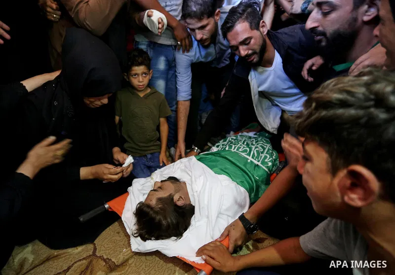Mourners carry the body of Palestinian Fadi Hijazi, 21, who was died of his wounds which he sustained in February of this year by Israeli forces during clashes in tents protest where Palestinians demand the right to retu...
