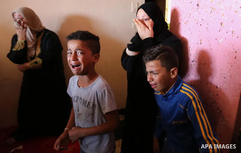Relatives of Palestinian Fadi Hijazi, 21, who was died of his wounds which he sustained in February of this year by Israeli forces, mourn during his funeral in Beit Hanoun in the northen Gaza Strip on October 7, 2019. Ph...