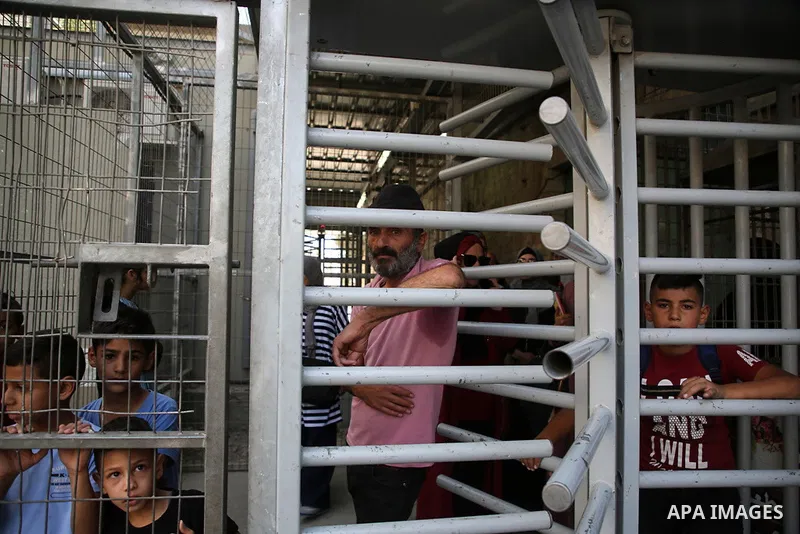 Israeli security forces stand guard at the entrance of al-Shuhada street that Israel unilaterally closed it in 1994 in the West Bank city of Hebron, October 10, 2019, Israeli settler Baruch Goldstein opened fire in the I...