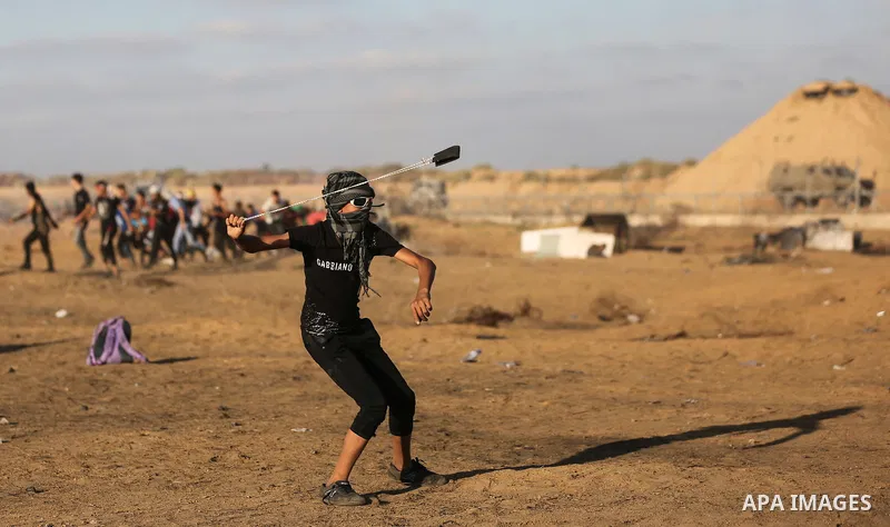 Palestinian protesters clash with Israeli troops following the tents protest where Palestinians demand the right to return to their homeland at the Israel-Gaza border, in Khan Younis in the southern Gaza Strip, on Octobe...