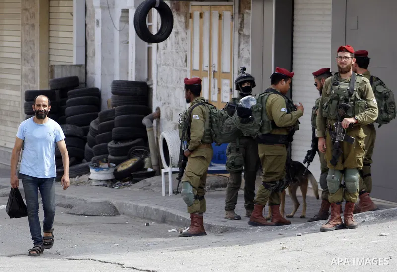 Israeli security forces and Jewish settlers close a street to mark the Sukkot (Feast of Tabernacles) which marks the exodus of the ancient Hebrew people from Egypt, in the West Bank city of Hebron on October 16, 2019. Sa...