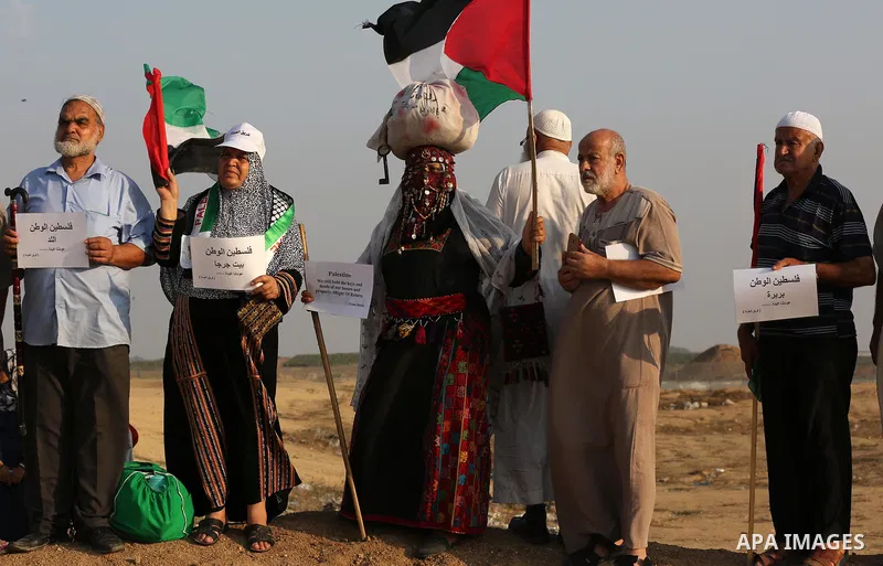 Palestinians take part in a protest to demand the right to return to their homeland at the Israel-Gaza border, in the east of Gaza City on October 16, 2019. Photo by Ashraf Amra