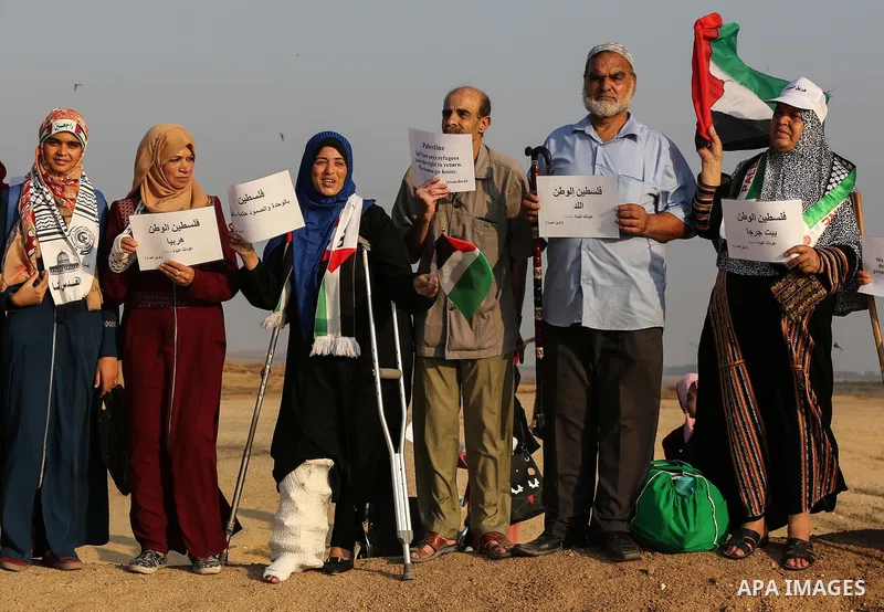 Palestinians take part in a protest to demand the right to return to their homeland at the Israel-Gaza border, in the east of Gaza City on October 16, 2019. Photo by Ashraf Amra