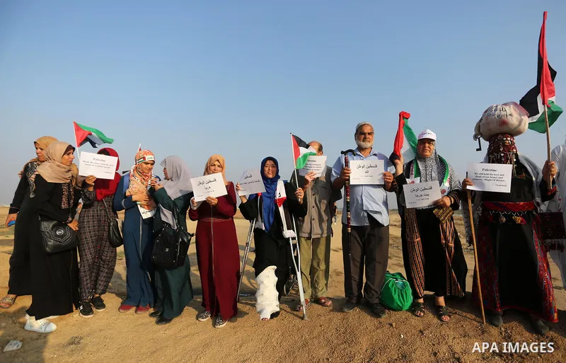 Palestinians take part in a protest to demand the right to return to their homeland at the Israel-Gaza border, in the east of Gaza City on October 16, 2019. Photo by Ashraf Amra