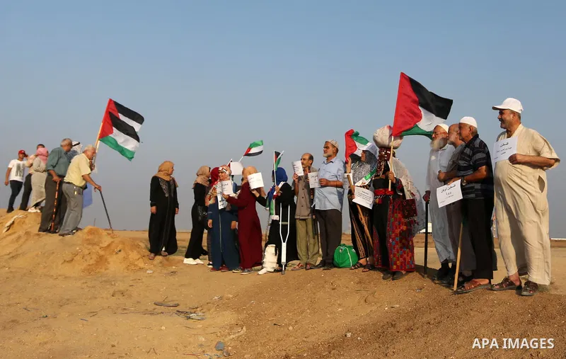 Palestinians take part in a protest to demand the right to return to their homeland at the Israel-Gaza border, in the east of Gaza City on October 16, 2019. Photo by Ashraf Amra