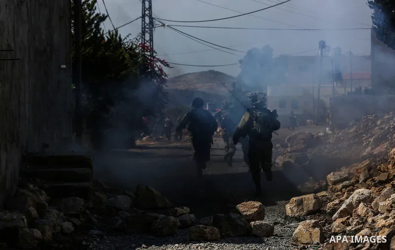 Israeli security forces take position during clashes with Palestinian protesters following a weekly demonstration against the expropriation of Palestinian land by Israel in the village of Kfar Qaddum, near the West Bank...