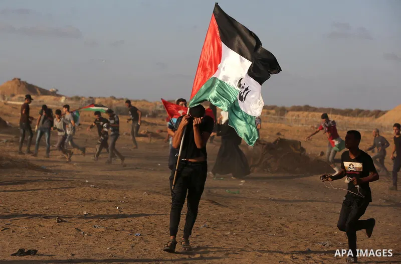 Palestinian protesters clash with Israeli troops following the tents protest where Palestinians demand the right to return to their homeland at the Israel-Gaza border, in Khan Younis in the southern Gaza Strip, on Octobe...