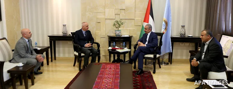 Palestinian Prime Minister Mohammad Ishtayeh, meets with Turkish Cooperation Agency (TICA) Program Coordinator in Palestine Ahmed Rafik Kaya, in the West Bank city of Ramallah, on October 31, 2019. Photo by Prime Ministe...