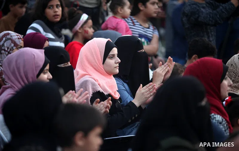 Palestinians attend a ceremony commemorating the birth of Prophet Mohammed, known in Arabic as "Mawlid al-Nabawi", in Gaza city on November 09, 2019. Photo by Mahmoud Ajjour