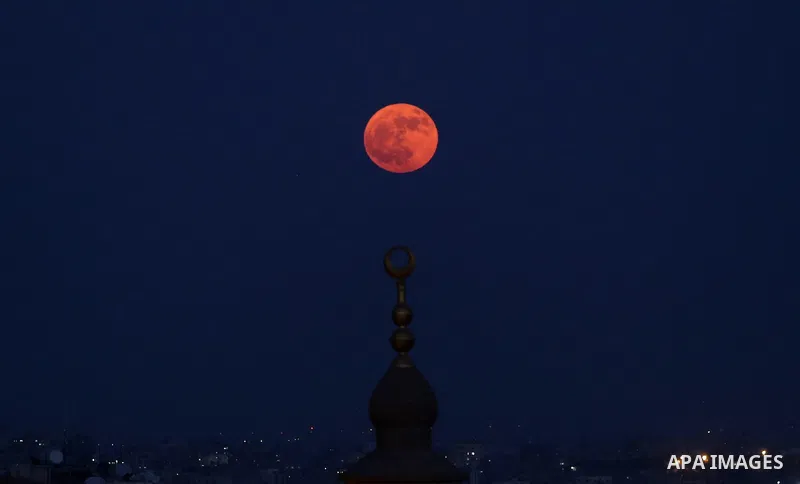 The moon is seen on the sky of Gaza city, on November 12, 2019. Photo by Ashraf Amra