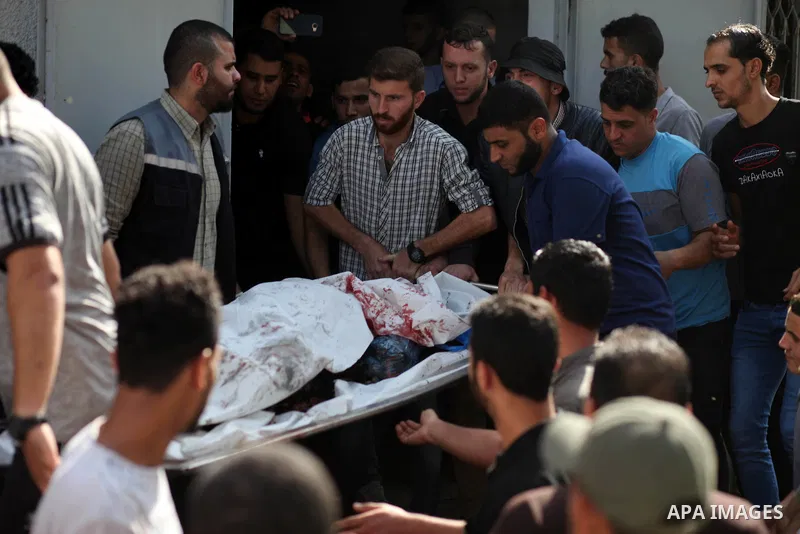 Relatives of Palestinian, who was died hit by an Israeli airstrike react at el-Shifa hospital morgue, in Gaza city on November 13, 2019. Photo by Mahmoud Ajjour