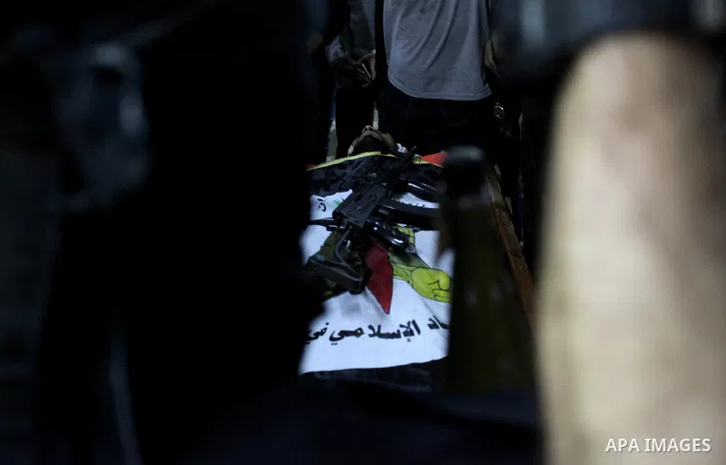 Relatives of Palestinian Yousef Abu Kamil, who was died hit by an Israeli airstrike, mourn over his body during his funeral in Gaza city on November 14, 2019. Photo by Mahmoud Ajjour