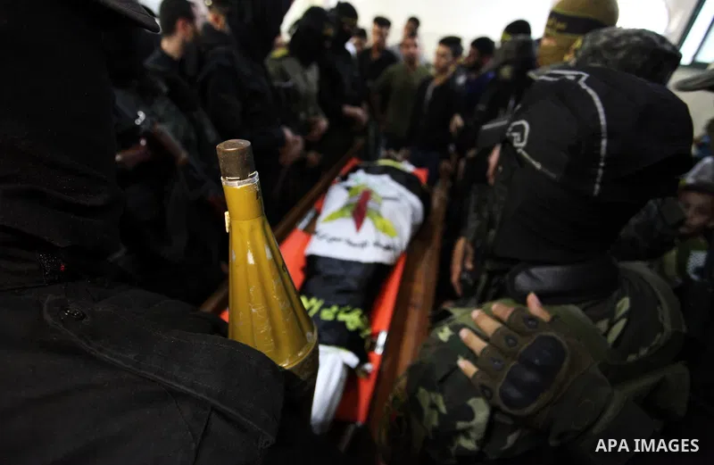 Relatives of Palestinian Yousef Abu Kamil, who was died hit by an Israeli airstrike, mourn over his body during his funeral in Gaza city on November 14, 2019. Photo by Mahmoud Ajjour