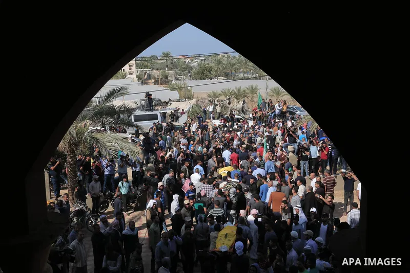 Mourners carry the bodies of Abu Malhous family, who were died hit by an Israeli airstrike during their funeral in Deir al-Balah, central of Gaza Strip on November 14, 2019. Israel and the Palestinian militant group Isla...