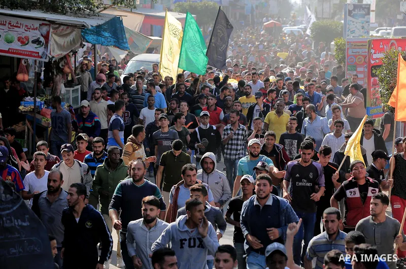 Mourners carry the bodies of Abu Malhous family, who were died hit by an Israeli airstrike during their funeral in Deir al-Balah, central of Gaza Strip on November 14, 2019. Israel and the Palestinian militant group Isla...