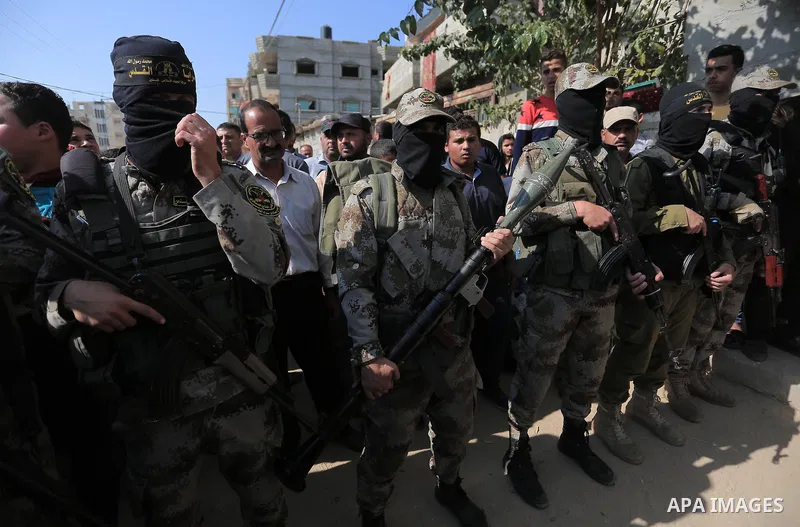 Mourners carry the body of Palestinian Mohammed Shurrab, who was died hit by an Israeli airstrike during his funeral in Khan Younis in the southern Gaza Strip on November 14, 2019. Photo by Ashraf Amra
