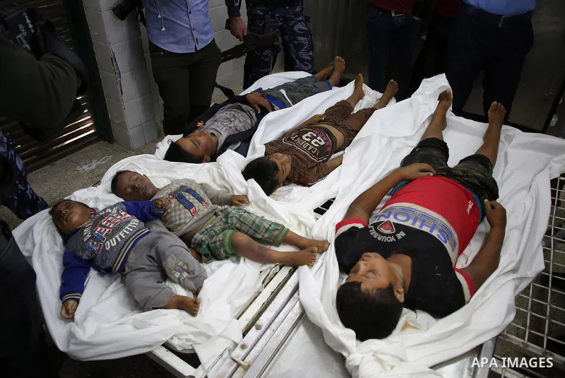 A picture taken on November 14, 2019. The bodies of Palestinians who were died hit by an Israeli airstrike, are seen at a hospital morgue, in Deir al-Balah, central of Gaza Strip. Israel said that it targeted Al Sawarka...