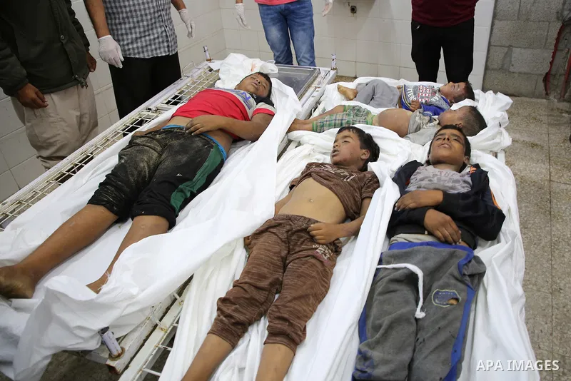 A picture taken on November 14, 2019. The bodies of Palestinians who were died hit by an Israeli airstrike, are seen at a hospital morgue, in Deir al-Balah, central of Gaza Strip. Israel said that it targeted Al Sawarka...