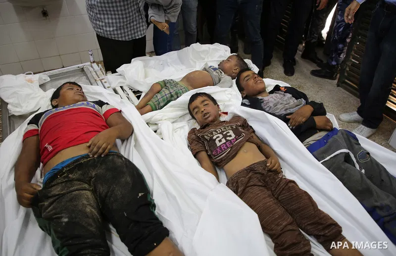 A picture taken on November 14, 2019. The bodies of Palestinians who were died hit by an Israeli airstrike, are seen at a hospital morgue, in Deir al-Balah, central of Gaza Strip. Israel said that it targeted Al Sawarka...