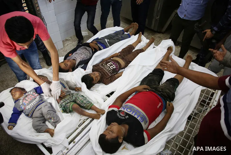 A picture taken on November 14, 2019. The bodies of Palestinians who were died hit by an Israeli airstrike, are seen at a hospital morgue, in Deir al-Balah, central of Gaza Strip. Israel said that it targeted Al Sawarka...