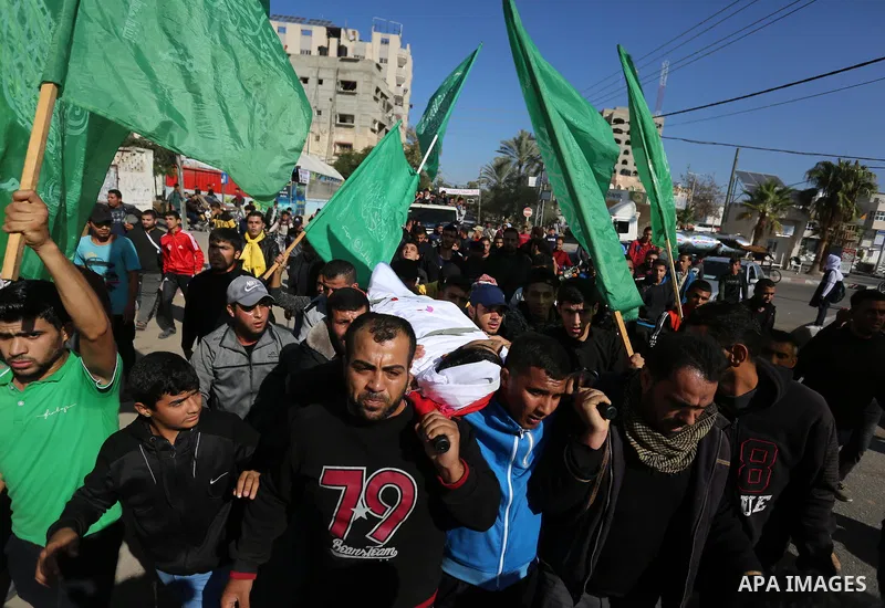 Mourners carry the body of Palestinian Fahad Al - Astal, 16, who was died of his wounds on 13 November 2019 during the recent escalation, during his funeral in Khan Youns southern in Gaza city, on November 30, 2019. Phot...