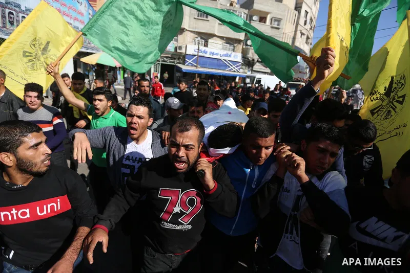 Mourners carry the body of Palestinian Fahad Al - Astal, 16, who was died of his wounds on 13 November 2019 during the recent escalation, during his funeral in Khan Youns southern in Gaza city, on November 30, 2019. Phot...