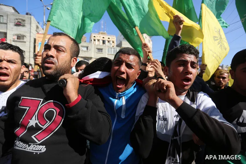 Mourners carry the body of Palestinian Fahad Al - Astal, 16, who was died of his wounds on 13 November 2019 during the recent escalation, during his funeral in Khan Youns southern in Gaza city, on November 30, 2019. Phot...