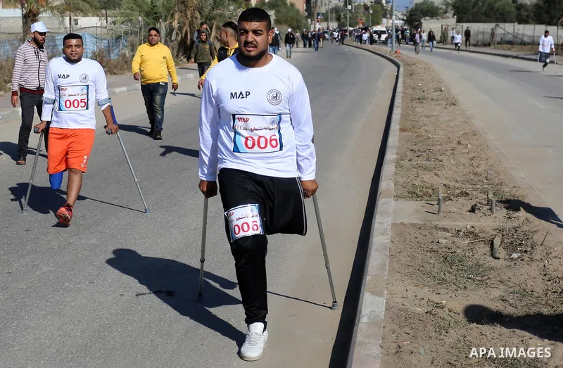 Palestinian amputees compete in a local run racing in Al-Nuseirat in the center of Gaza Strip, on December 5, 2019. Photo by Ashraf Amra