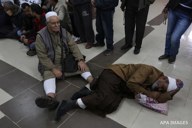 Palestinian owners of houses which were destroyed during the recent Israeli war, take part in a protest demanding repair their houses, at a United Nations-run health center, in Khan Younis in the southern of Gaza strip,...