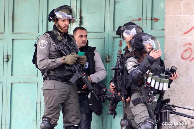 Israeli security forces take position during clashes with Palestinian protesters following protest over a U.S. decision on Jewish settlements, in the West Bank city of Hebron on December 9, 2019. Photo by Mosab Shawer