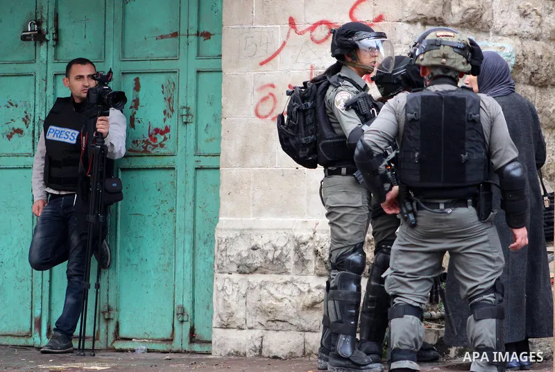 Israeli security forces arrest Palestinian youth during a protest over a U.S. decision on Jewish settlements, in the West Bank city of Hebron on December 9, 2019. Photo by Mosab Shawer