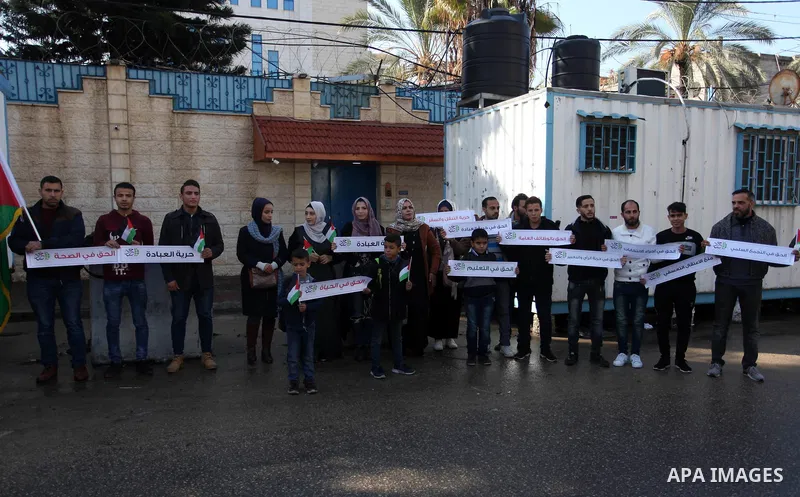Palestinians take part in a rally demanding their rights on the occasion of the universal declaration of Human Rights in front of the office of the High Commissioner, in Gaza city, on December 10, 2019. Photo by Mahmoud...