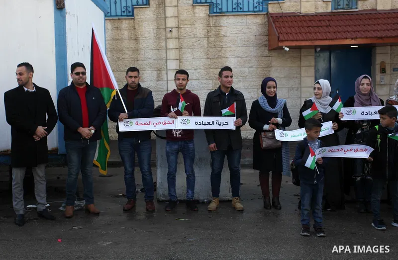 Palestinians take part in a rally demanding their rights on the occasion of the universal declaration of Human Rights in front of the office of the High Commissioner, in Gaza city, on December 10, 2019. Photo by Mahmoud...
