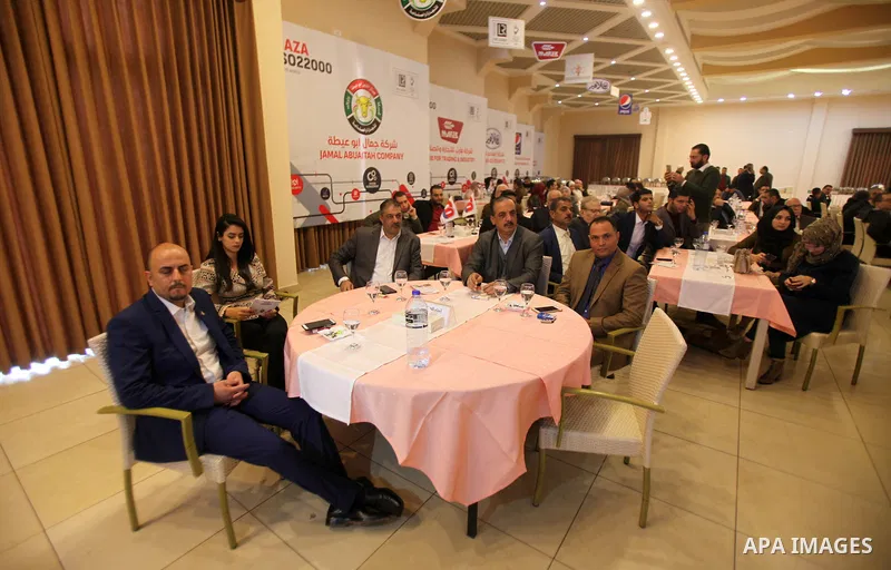 Palestinians attend a ceremony honoring companies holding ISO22000 certificates, in Gaza city on December 11, 2019. Photo by Mahmoud Ajjour