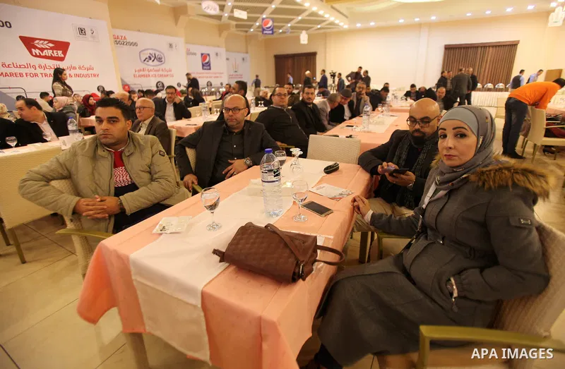 Palestinians attend a ceremony honoring companies holding ISO22000 certificates, in Gaza city on December 11, 2019. Photo by Mahmoud Ajjour