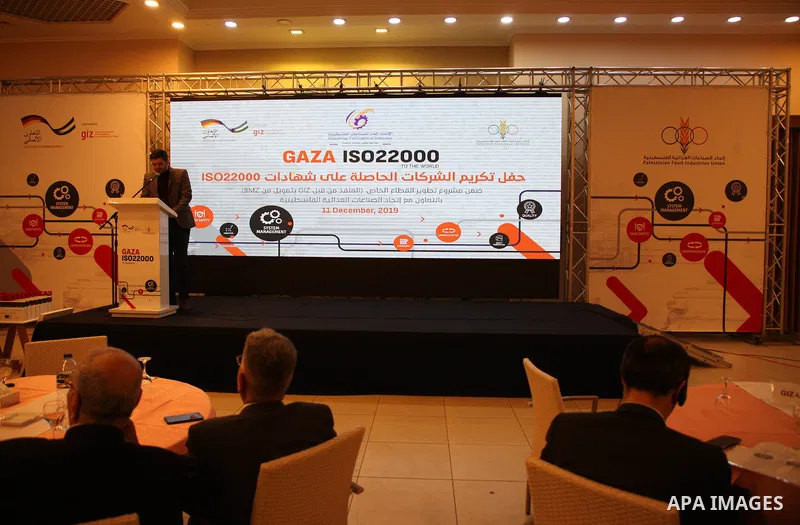 Palestinians attend a ceremony honoring companies holding ISO22000 certificates, in Gaza city on December 11, 2019. Photo by Mahmoud Ajjour